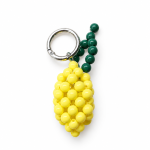 Yellow beaded lemon bag charm with green stem and silver key ring