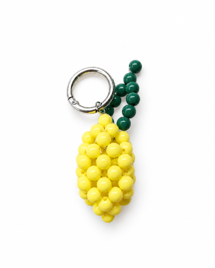 Yellow beaded lemon bag charm with green stem and silver key ring