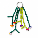 Colorful handmade beaded flower bag charm on a white background