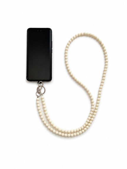 Beige handmade acrylic bead phone strap displayed with a phone