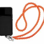 Orange handmade acrylic bead phone strap displayed with a phone