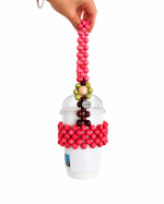 Berry Bloom wooden bead cup carrier holding a 12 oz takeaway cup