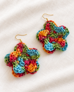 Pair of colorful raffia flower earrings in red, yellow, turquoise and green with gold-tone hooks