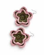 Pink and olive green open bloom raffia flower earrings laid flat with silver-tone hooks