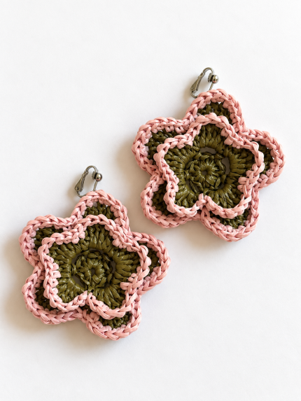 Pair of pink and olive green open bloom raffia flower earrings with silver-tone clip-on fastenings
