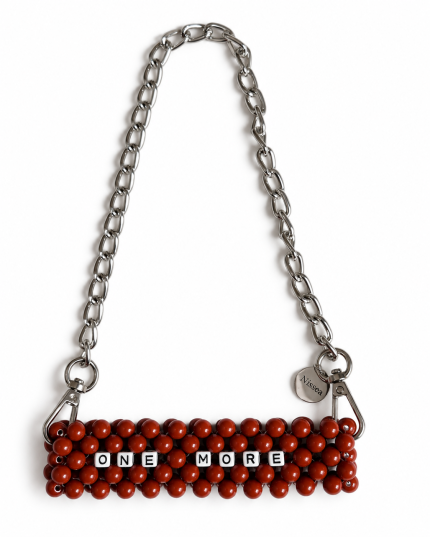 ONE MORE beaded cup carrier with reddish-brown beads and a silver-tone chain laid flat