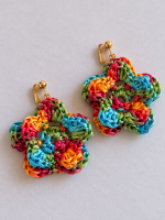 Pair of colorful raffia flower earrings in red, yellow, turquoise and green with gold-tone clip-on fastenings